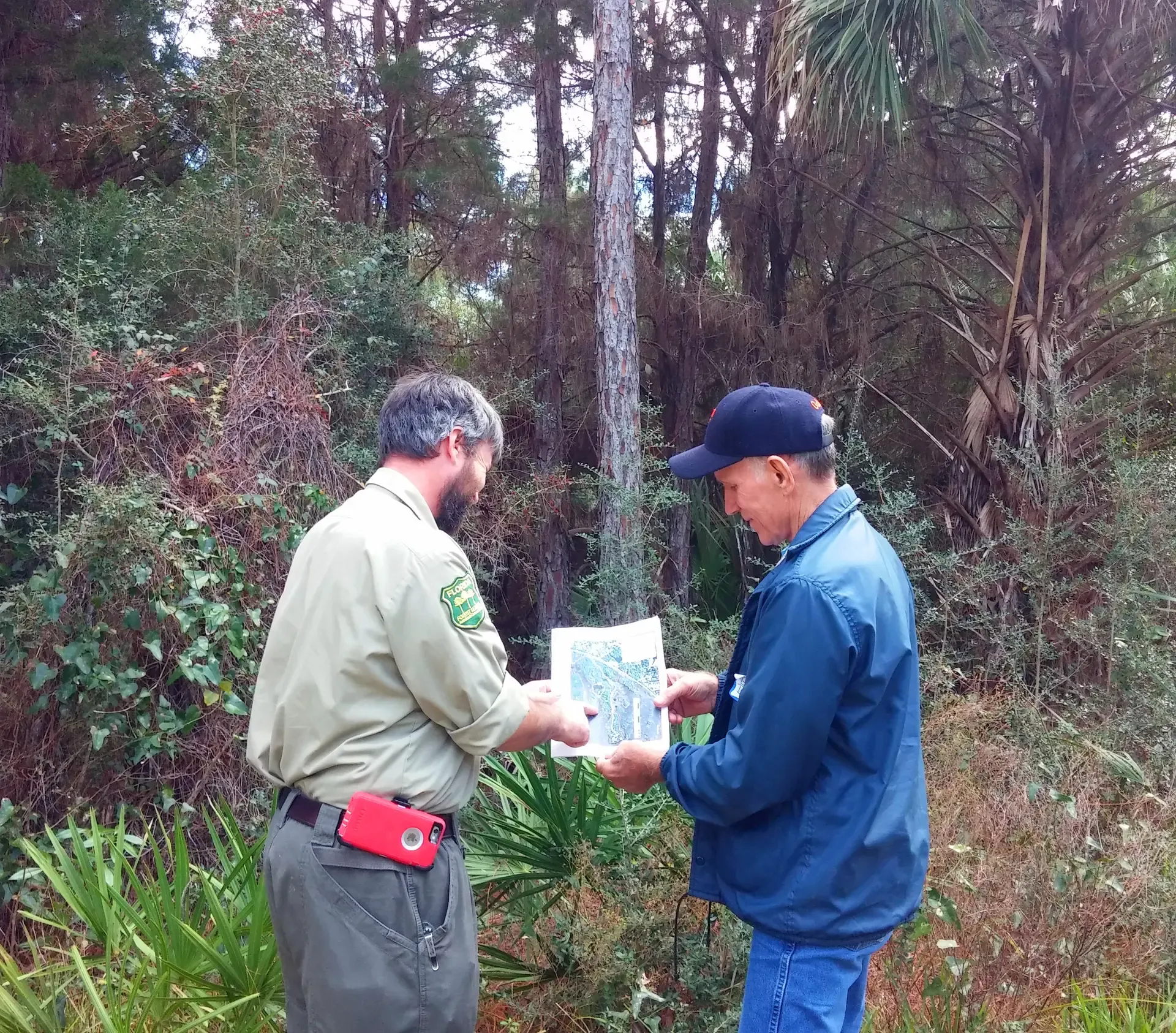 Landowner and Forester reviewing map-southern US